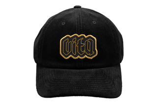 Black corduroy hat with patch featuring Vita logo in gold with gold outline