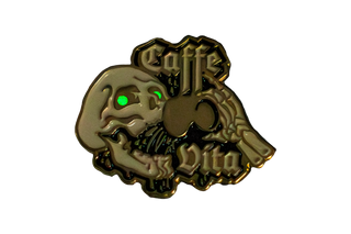 Enamel pin of skull with glowing green eyes drinking coffee and Caffe Vita logo